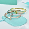 Tiffany Wide Cubic Zirconia Hinged Bangle